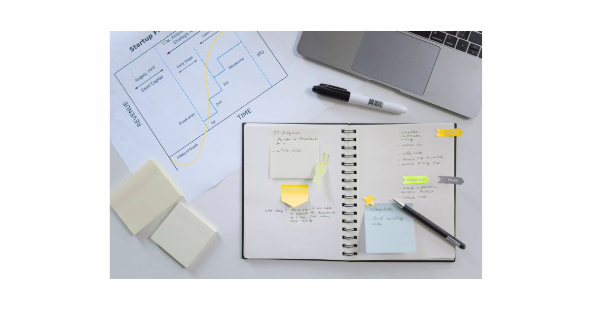 Brand strategy planning for startups with business roadmap, marketing notes, notebook, and laptop workspace focused on startup growth, positioning, and business development.